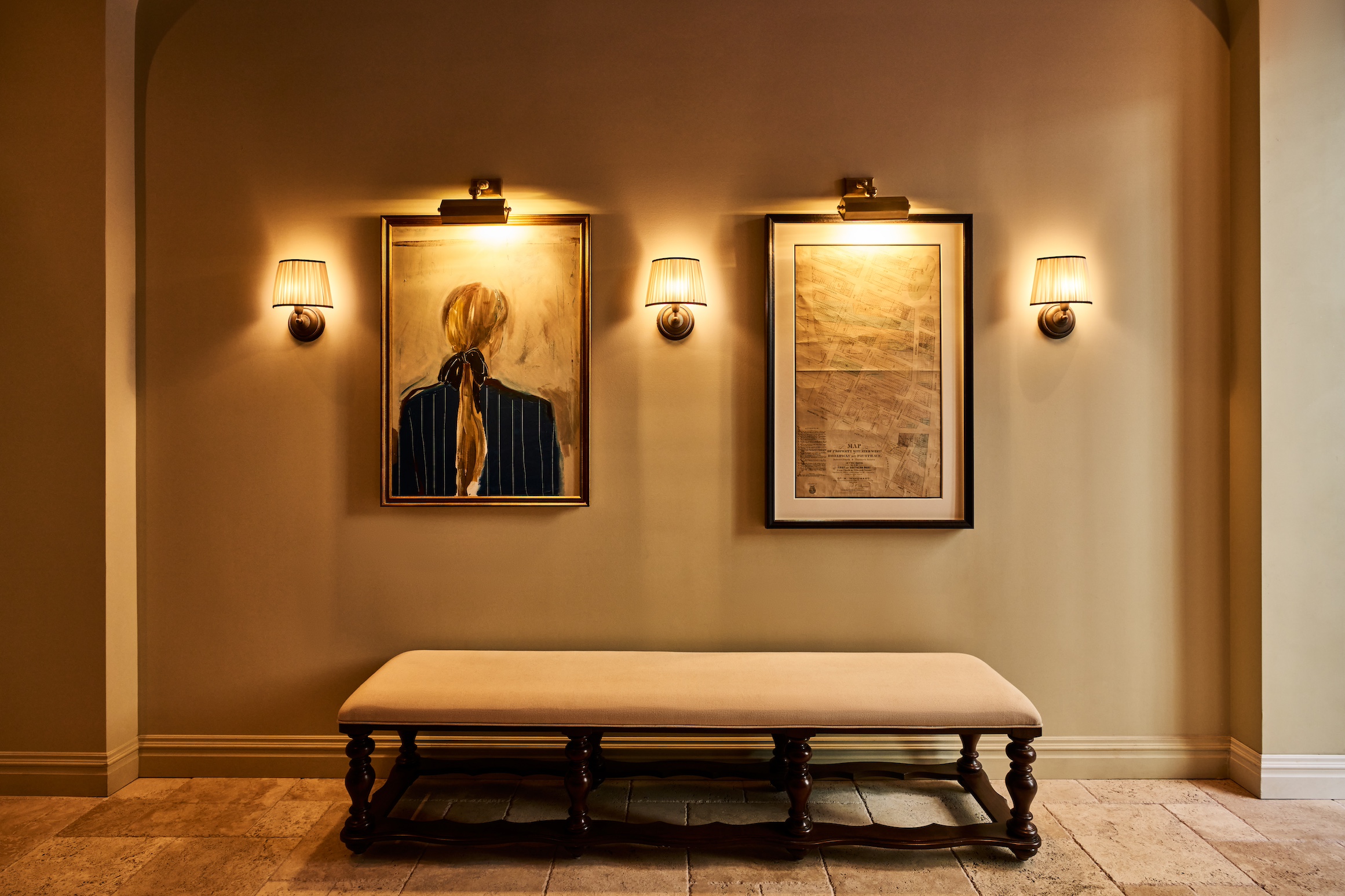 Lobby view at The Twenty Two New York, showcasing elegant seating and artwork on the wall, creating a refined and inviting ambiance.