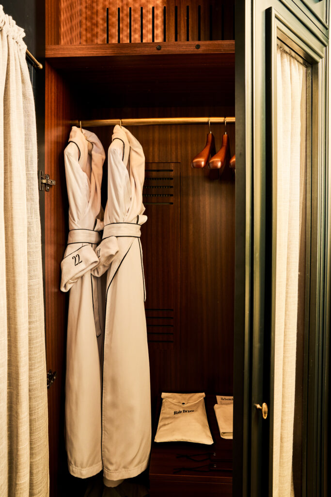 Closet view in The Twenty Two New York, featuring two plush robes hanging, adding a touch of luxury and comfort.